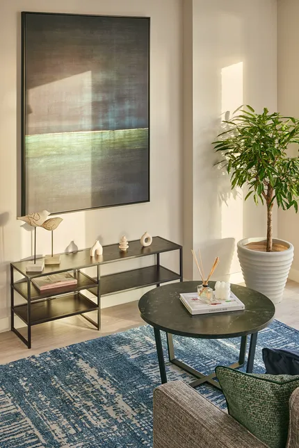 Living room area showing artwork and tv console