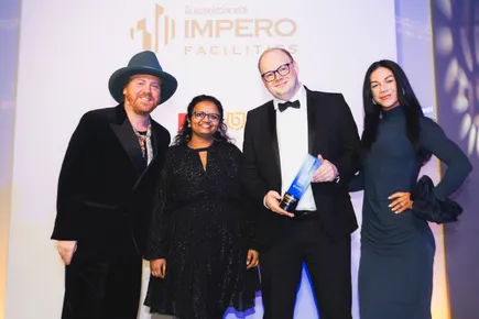 Team collecting an award on stage