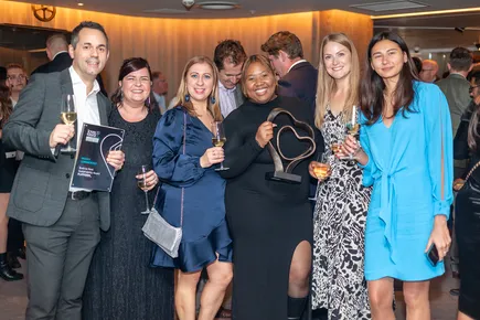 Group of people holding Love to Rent Award