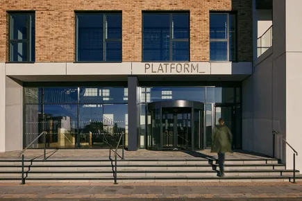 Exterior of PLATFORM_ in Glasgow showing young adult walking into reception