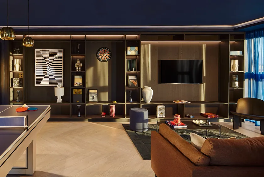 Games room showing tv and lounge with table tennis